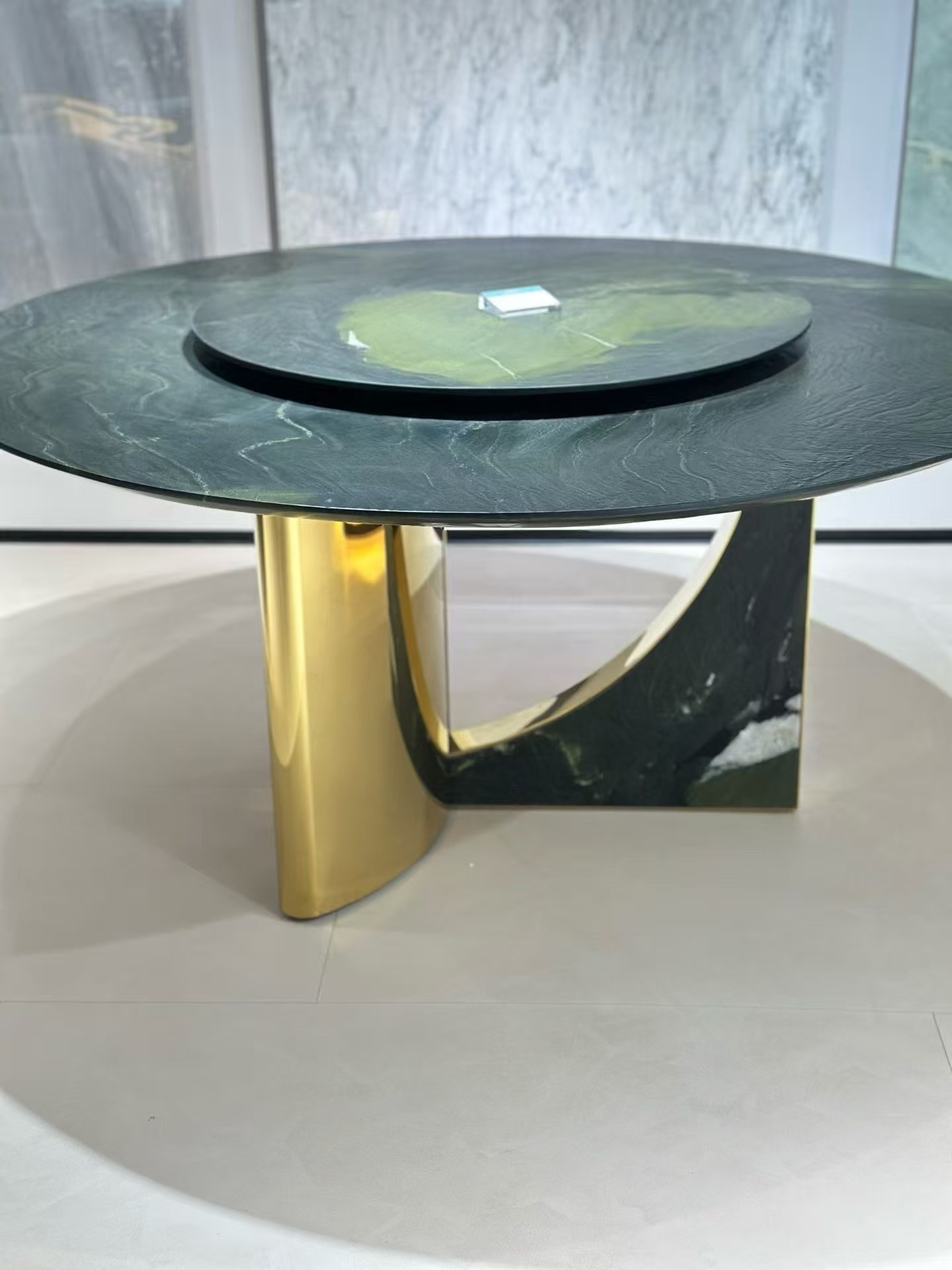 Curved black gold and green marble dining table