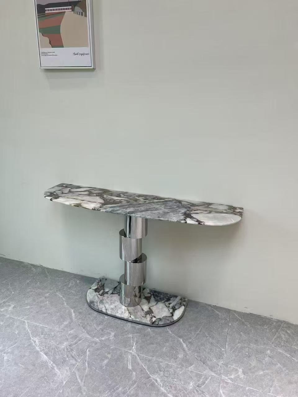 Stacked cylindrical glossy stainless steel porch table